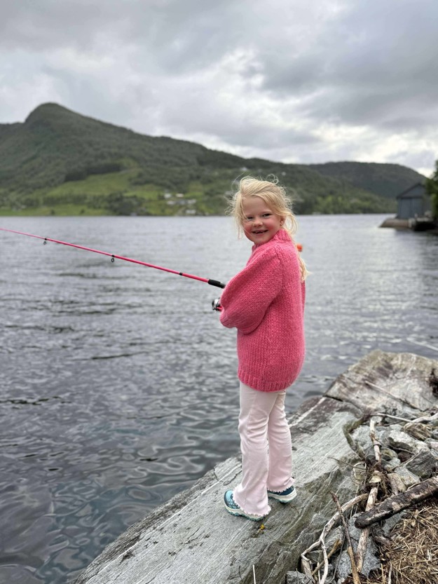 Johanna is fishing from the shore.